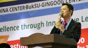 September 2017 Licensure Examination for Teachers Top 9 passer Jestonie Y. Dadobo gives his message as the guest speaker in the 13th Joint Commencement Exercises of the external studies center in Gingoog, Medina and Magsaysay, Misamis Oriental. The ceremonies were held in a gymnasium in Gingoog City/Courtesy of the Office of the External and Extension Studies Center Coordinator