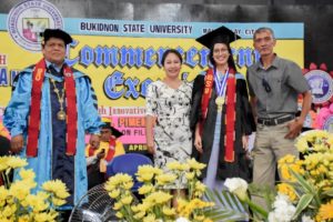 Doreen Khrystel P. Gonzales, who graduates cum laude and receives leadership and special awards, pose with her parents and Dr. Oscar B. Cabañelez, university president during the 84th Commencement Exercises at the BukSU Gymnasium, Malaybalay City, Philippines Photo courtesy of Christopher Cordova/BukSU ICTU