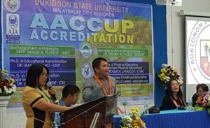 Dr. Jean L. Bejano, over-all coordinator of the AACCUP preliminary survey visit team, introduces her team during the opening program on May 21, 2018 at the BukSU Audio-Visual Center Information and Publication Service photo